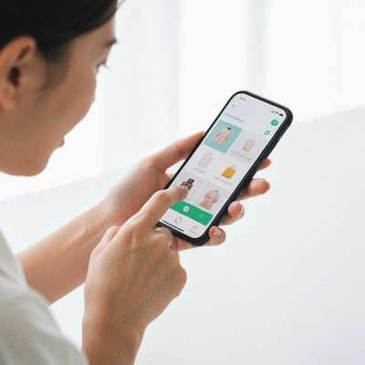 Person using a smartphone to shop online, demonstrating mobile-first shopping